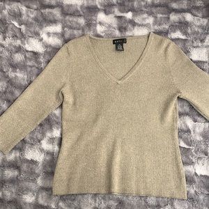 Light sweater material gold with sparkles.  stretchy material